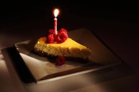 cheesecake with fruits in the dark night 