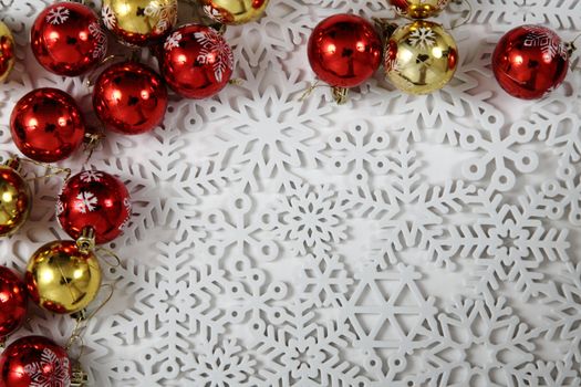 easy christmas background from snowflakes with xmas balls