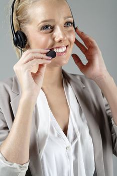 Call centre operator using a telephone headset.