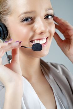 Call centre operator using a telephone headset.