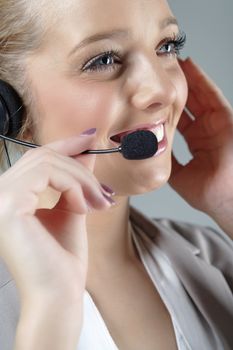 Call centre operator using a telephone headset.
