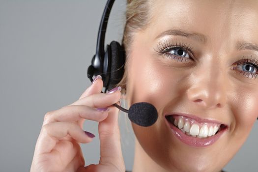 Call centre operator using a telephone headset.