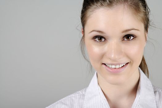 Young woman in smart shirt facing the camera