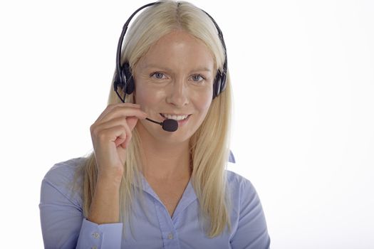 Young woman in smart clothes using a call centre head set