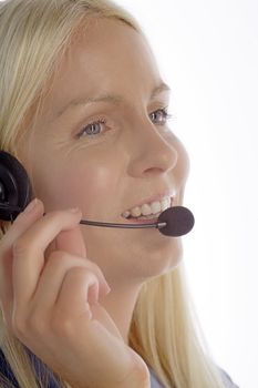 Young woman in smart clothes using a call centre head set