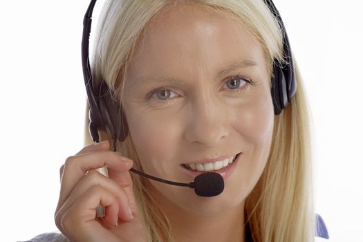 Young woman in smart clothes using a call centre head set