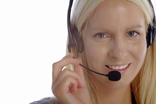 Young woman in smart clothes using a call centre head set