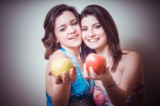 two beautiful girls on gray background