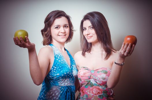 two beautiful girls on gray background