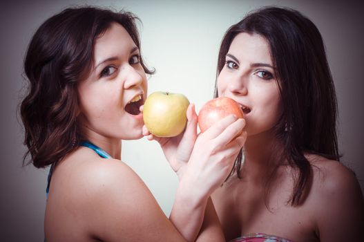 two beautiful girls on gray background