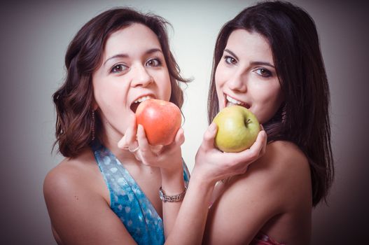 two beautiful girls on gray background