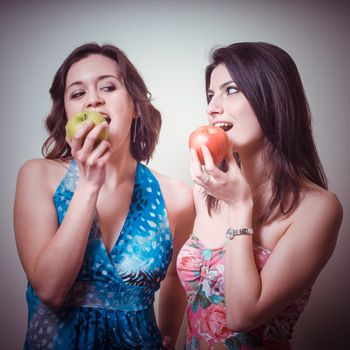 two beautiful girls on gray background