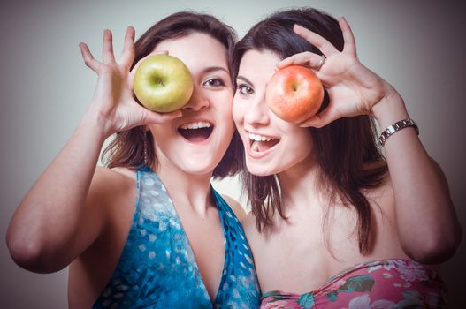 two beautiful girls on gray background