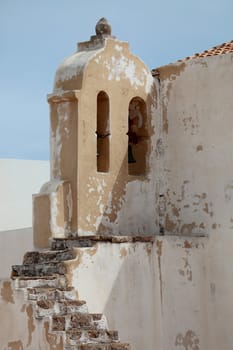 photograph of an old bell tower in ruins