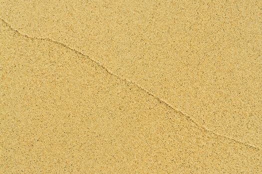 sand background texture. shot of sand at the beach.