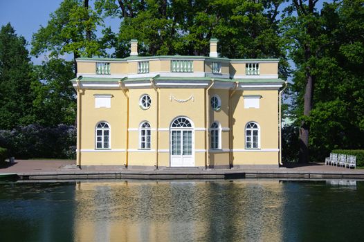 Antique baroque style lodge in the park by a pond. Pushkin ??city, Russia.