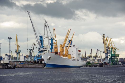 Ship and cranes. Harbor activity. St. Petersburg. Russia.