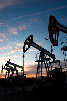 oil pumps on the sunset sky background 