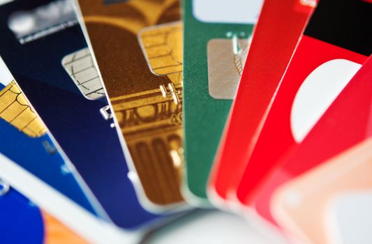 stack colorful plastic credit cards, closeup, selective focus