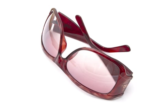 Red sunglasses closuep on white background