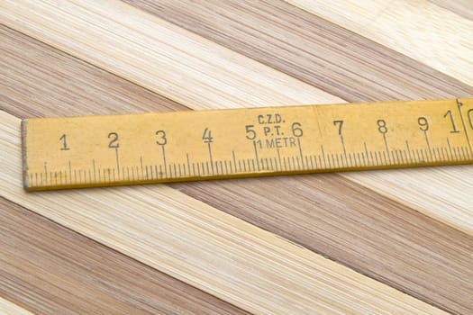 Tape measure closeup on wood background 