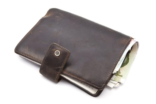 Brown wallet with currency closeup on white background 