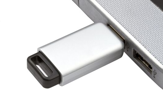 USB Flash Drive and laptop isolated on white