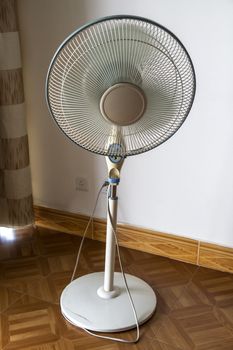 Old electric floor fan closeup in the room