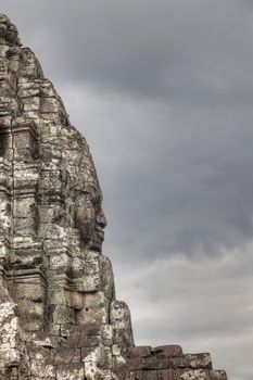 Stone face profile on the Bayon temple in Cambodia