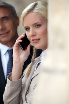 Young woman pensive on phone