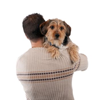 Portrait of a man holding a cute mixed breed dog over his shoulder isolated over white.