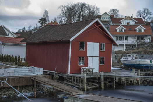 Sponvika is a village in Halden municipality, Norway. The picture shows a twisted boathouse located just near the seaside. The picture is shot one day in March 2013.