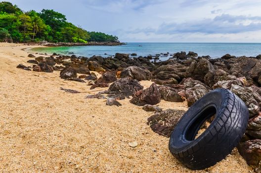 Washed out tyre at beautiful ocean coast in Andaman sea, Thailand