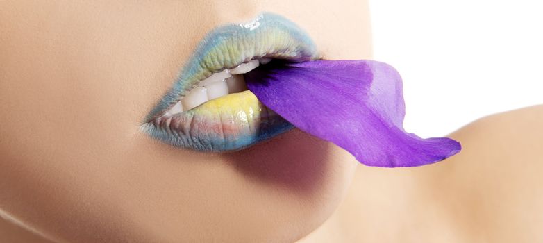 Woman's lips with flower