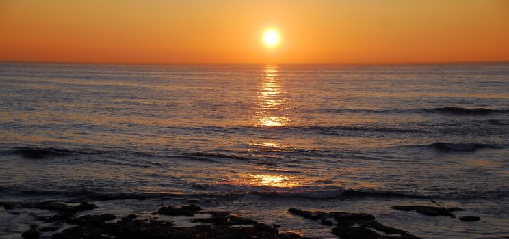 Sunset in the evening on a sea beach