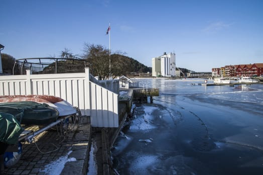 The quayside in the harbor of Halden, Norway is frozen into ice. The picture was shot one day in March 2013.