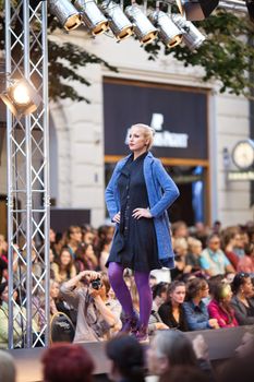 PRAGUE-SEPTEMBER 24: A model walks the runway during the 2011 autumn/winter Czech designers collection during the Prague Fashion Weekend on September 24, 2011 in Prague, Czech Republic.