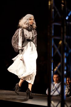 PRAGUE-SEPTEMBER 24: A model walks the runway during the 2011 autumn/winter Nina Ricci Paris Collection by Obsession during the Prague Fashion Weekend on September 24, 2011 in Prague, Czech Republic.