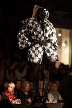 PRAGUE-SEPTEMBER 24: A model walks the runway during the 2011 autumn/winter Nina Ricci Paris Collection by Obsession during the Prague Fashion Weekend on September 24, 2011 in Prague, Czech Republic.