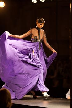 PRAGUE-SEPTEMBER 24: A model walks the runway during the 2011 autumn/winter Nina Ricci Paris Collection by Obsession during the Prague Fashion Weekend on September 24, 2011 in Prague, Czech Republic.