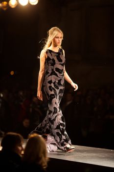 PRAGUE-SEPTEMBER 24: A model walks the runway during the 2011 autumn/winter Nina Ricci Paris Collection by Obsession during the Prague Fashion Weekend on September 24, 2011 in Prague, Czech Republic.