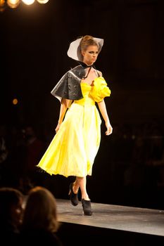 PRAGUE-SEPTEMBER 24: A model walks the runway during the 2011 autumn/winter Nina Ricci Paris Collection by Obsession during the Prague Fashion Weekend on September 24, 2011 in Prague, Czech Republic.