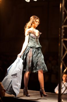 PRAGUE-SEPTEMBER 24: A model walks the runway during the 2011 autumn/winter Nina Ricci Paris Collection by Obsession during the Prague Fashion Weekend on September 24, 2011 in Prague, Czech Republic.