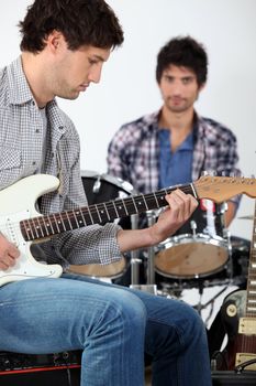 young men playing music