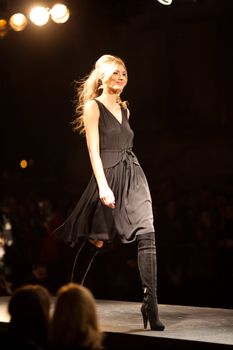 PRAGUE-SEPTEMBER 24: A model walks the runway during the 2011 autumn/winter Nina Ricci Paris Collection by Obsession during the Prague Fashion Weekend on September 24, 2011 in Prague, Czech Republic.