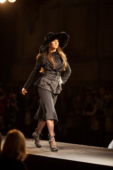 PRAGUE-SEPTEMBER 24: A model walks the runway during the 2011 autumn/winter Nina Ricci Paris Collection by Obsession during the Prague Fashion Weekend on September 24, 2011 in Prague, Czech Republic.