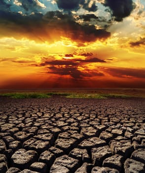 dramatic sunset over drought land