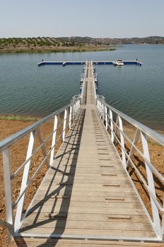 Wooden walkway serving Amieira pier on the banks of the reservoir of Alqueva, Alentejo, Portugal