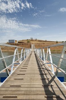 Wooden walkway serving Amieira pier on the banks of the reservoir of Alqueva, Alentejo, Portugal