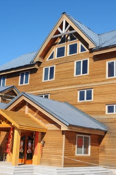 Wooden cottage against blue sky